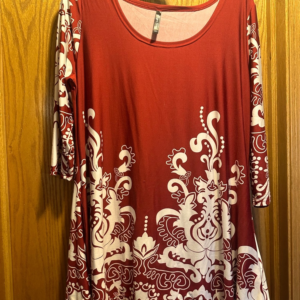 Long tunic with shark bite hem